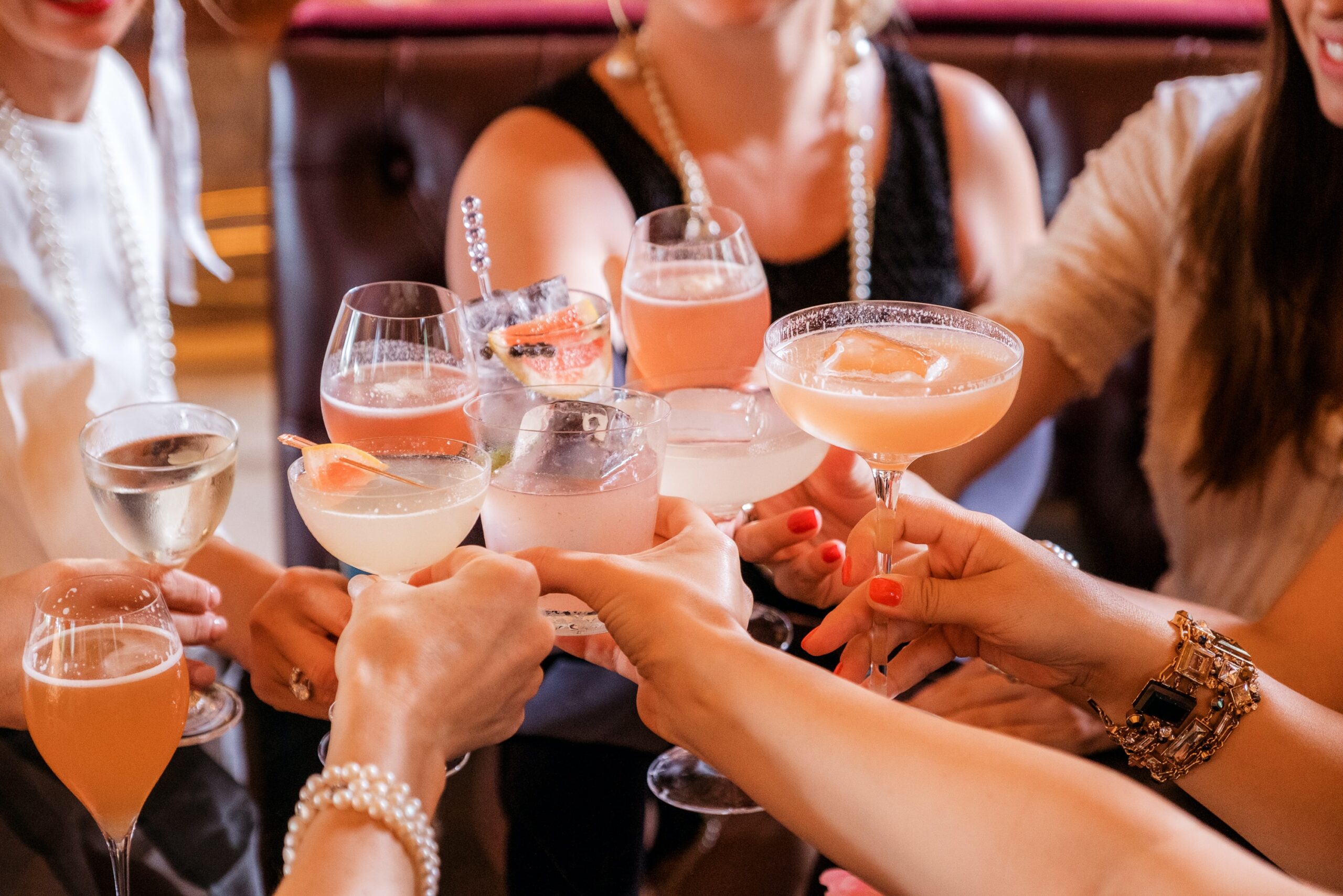 friends enjoying the atmosphere with cocktails 